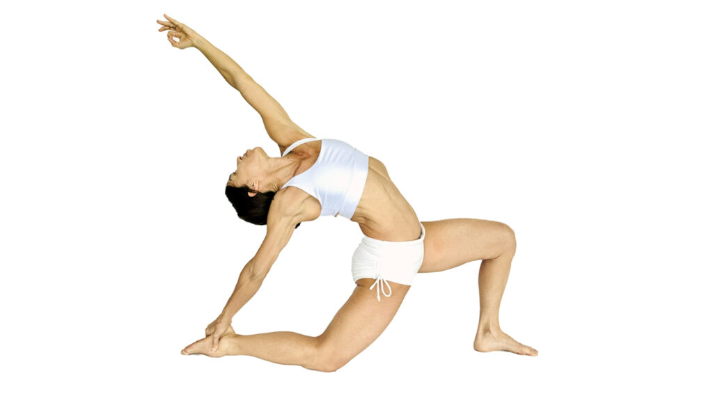 Studio Director Pachi Shanaberger of Prana Hot Yoga + Bodywork in Fort Lauderdale performing a deep Low Lunge (Anjaneyasana) with a graceful backbend, wearing white athletic wear against a white background.