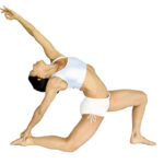 Studio Director Pachi Shanaberger of Prana Hot Yoga + Bodywork in Fort Lauderdale performing a deep Low Lunge (Anjaneyasana) with a graceful backbend, wearing white athletic wear against a white background.